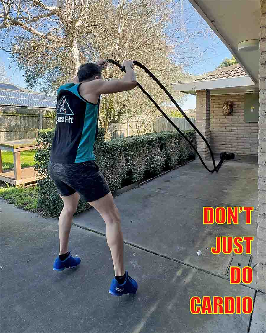 Personal trainer demonstrating battle ropes and skipping during cardio training in Traralgon.